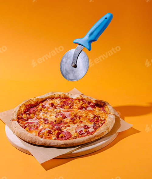 Preview: Perfectly cooked pepperoni pizza with a pizza cutter above it