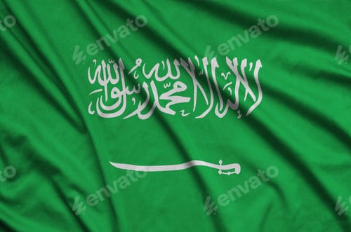 Preview: Saudi Arabia flag is depicted on a sports cloth fabric with many folds. Sport team waving banner