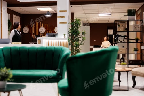 Preview: Concierge in managers office at resort