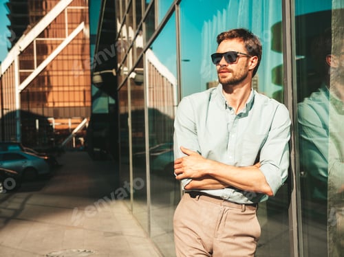 Preview: Handsome man posing outdoors