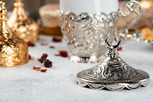 Preview: Arabic metal dishware and dry fruits on table