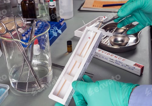 Preview: Police expert extracts traces of blood in a swab for analysis