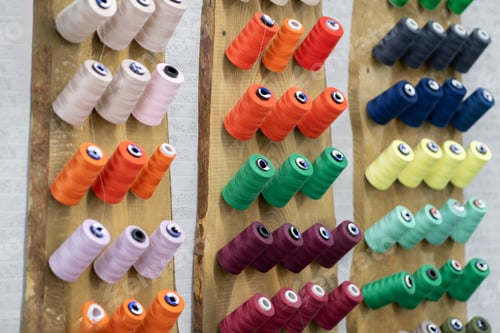 Preview: a collection of colorful thread rolls on sewing manufacture