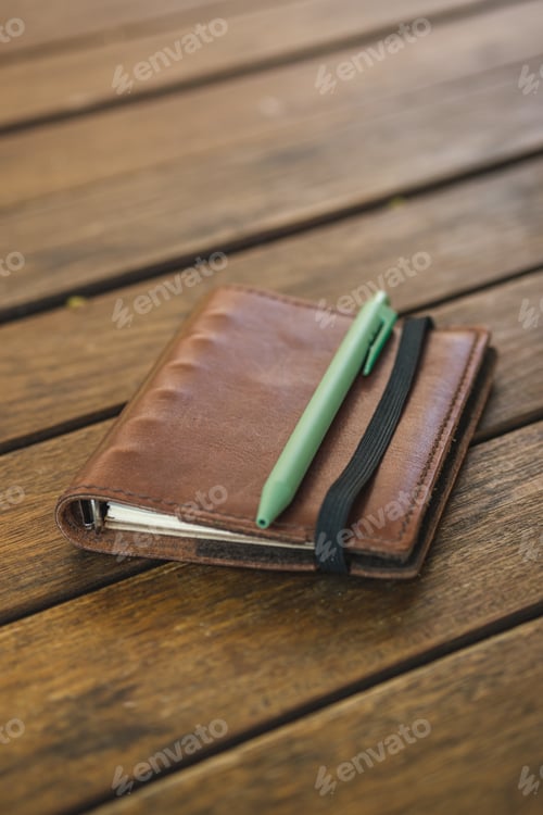 Preview: notebook at coffee shop outdoor space table