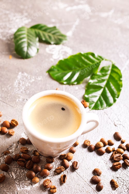 Preview: Coffee cup and beans on old kitchen table. Top view with copyspace for your text