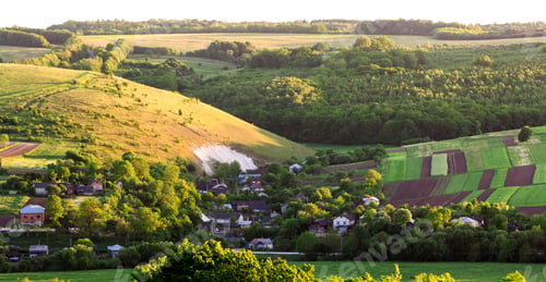 Preview: Beautiful wide aerial view of small village among green gardens