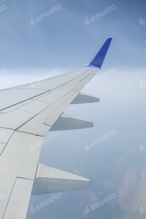 Preview: Trips. Airplane wing from an illuminator, Travel by plane, open borders, relaxas, sky, clouds