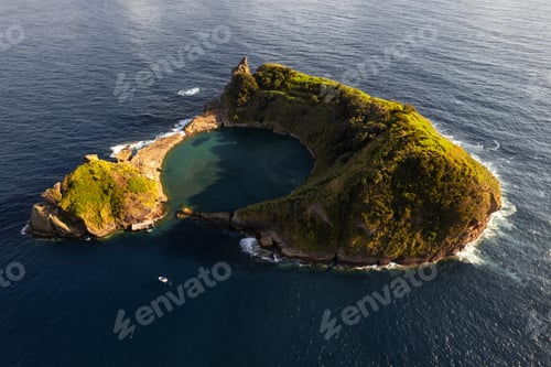 Preview: Picturesque volcanic islet in wavy ocean on sunny day