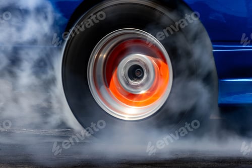 Preview: Car burnout wheels tire with white smoke,Car wheel burnout with smoke from the spinning tyre.