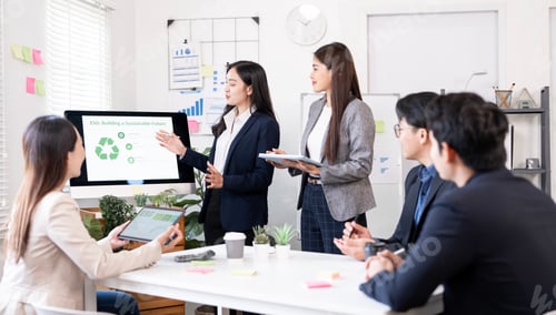 Preview: Asian business team presenting ESG strategy during a meeting in modern office,