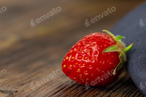 Preview: Red ripe fresh strawberry with leaves close up