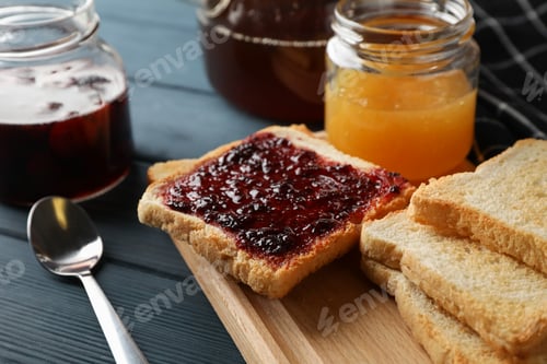 Preview: Toasts, jam and tea on wooden background, close up