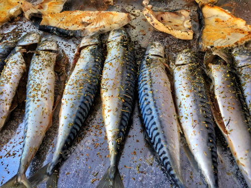 Preview: Some fresh fish on a hot metal plate being cooked