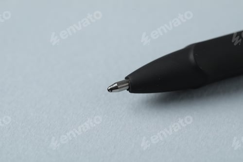 Preview: One ballpoint pen on grey background, macro view. Space for text