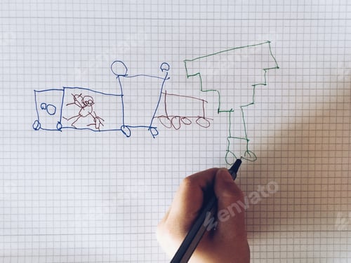 Preview: Child drawing with pen on paper