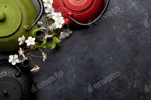 Preview: Japanese tea in tea pot and cherry blossom