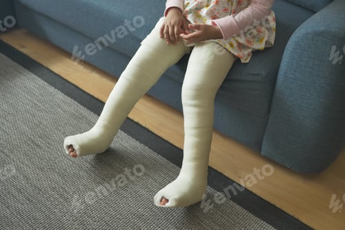 Preview: little child with plaster bandage on leg.