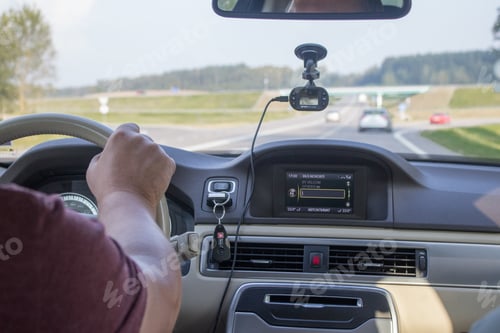 Preview: man driving a car - hands closeup