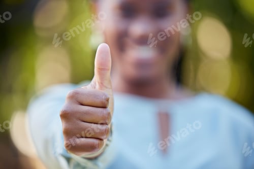 Preview: Hand, closeup and thumbs up by black woman showing yes, recommendation or thank you on bokeh backgr