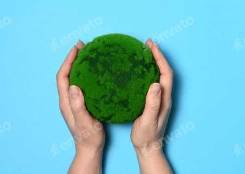 Preview: Hands with a green planet