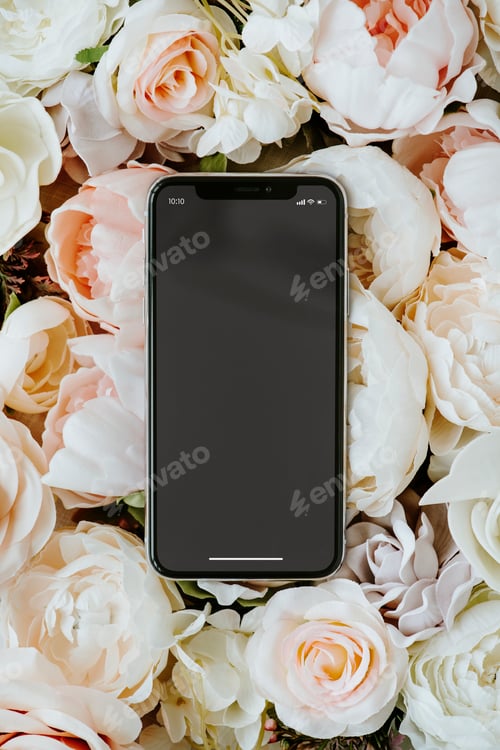 Preview: Blank black phone on pastel roses