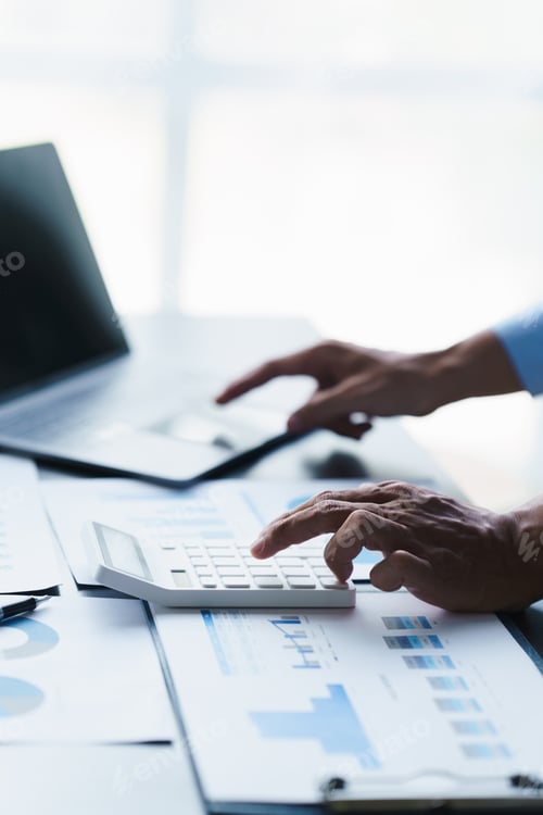 Preview: businessman working in office with using calculator and laptop. concept finance and accounting