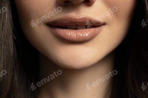 Preview: Lips of a young girl close-up on a light background