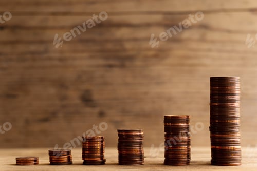 Preview: Stacks of shiny small value copper euro coins.