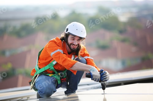 Preview: Workers Installing Solar Panels on warehouse Roof.