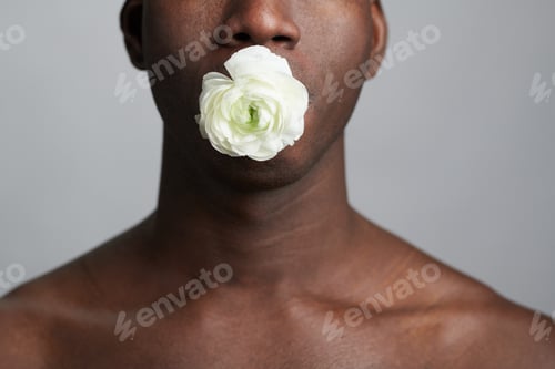 Preview: Young man holding white flower