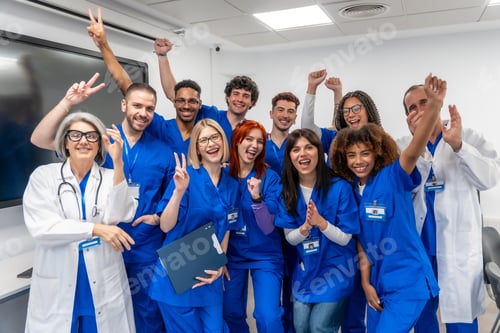 Preview: Medical team celebrating success and triumph in hospital