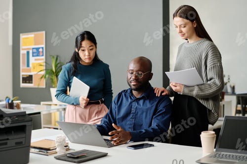 Preview: Black Man Asking Advice From His Colleagues