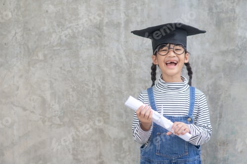 Preview: Happy Asian school kid graduate in graduation cap