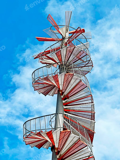 Preview: View From Below To Spiral Creative Construction Architecture Building on Blue Cloudy Sky Background