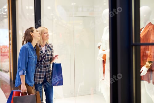 Preview: Women Enjoying Window Shopping in the Mall