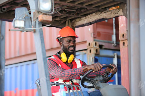 Preview: Foreman control loading Containers box from Cargo freight ship for import export.