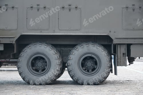 Preview: Close up of green military truck. Modern military transportation