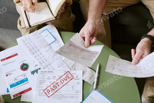 Preview: Senior Couple Reviewing Past Due Bills and Financial Documents