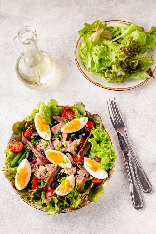 Preview: salad Nicoise with tuna, eggs, green beans, tomatoes, olives, lettuce and anchovies