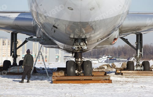 Preview: Close up of old unused large passenger plane on a snowy field