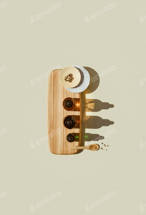 Preview: Various glass bottles with CBD oil, THC tincture capsule on beige background. Flat lay, minimalism