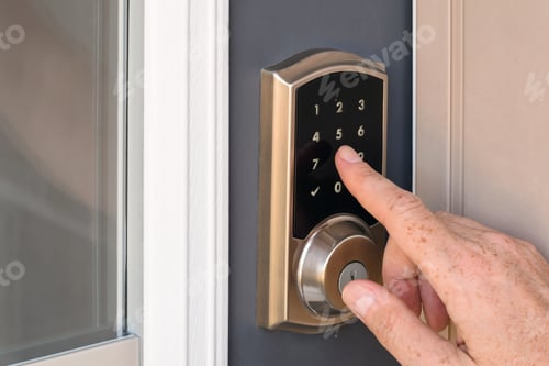Preview: Hand entering code into home door lock