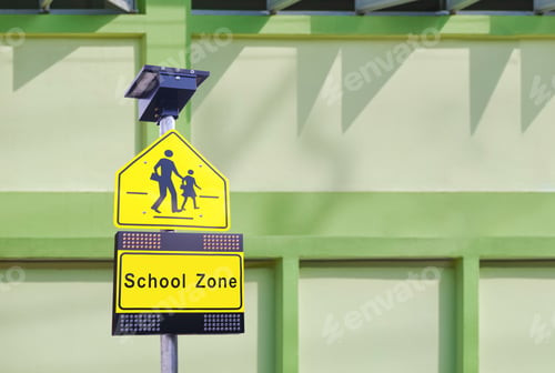 Preview: LED solar cell warning light with traffic security school sign on signpost in front of school