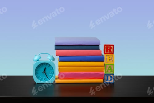 Preview: Stack of books on black wooden table
