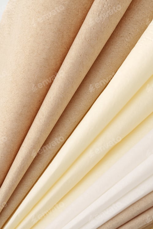 Preview: White and beige folded paper napkins close up