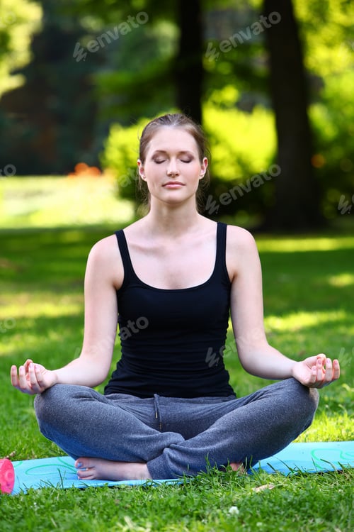 Preview: Beautiful woman relaxing in yoga pose