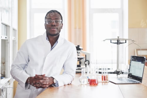Preview: An African American worker works in a laboratory conducting experiments
