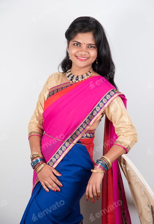 Preview: Happy young beautiful Indian woman in saree.