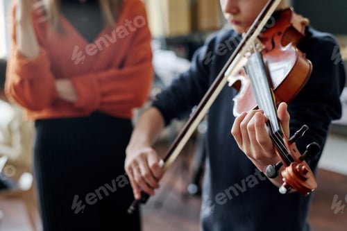 Preview: Unrecognizable Boy Learning To Play Violin
