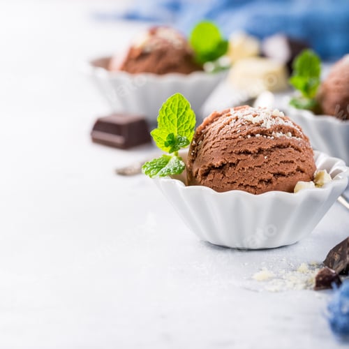 Preview: Chocolate ice cream in white bowl.